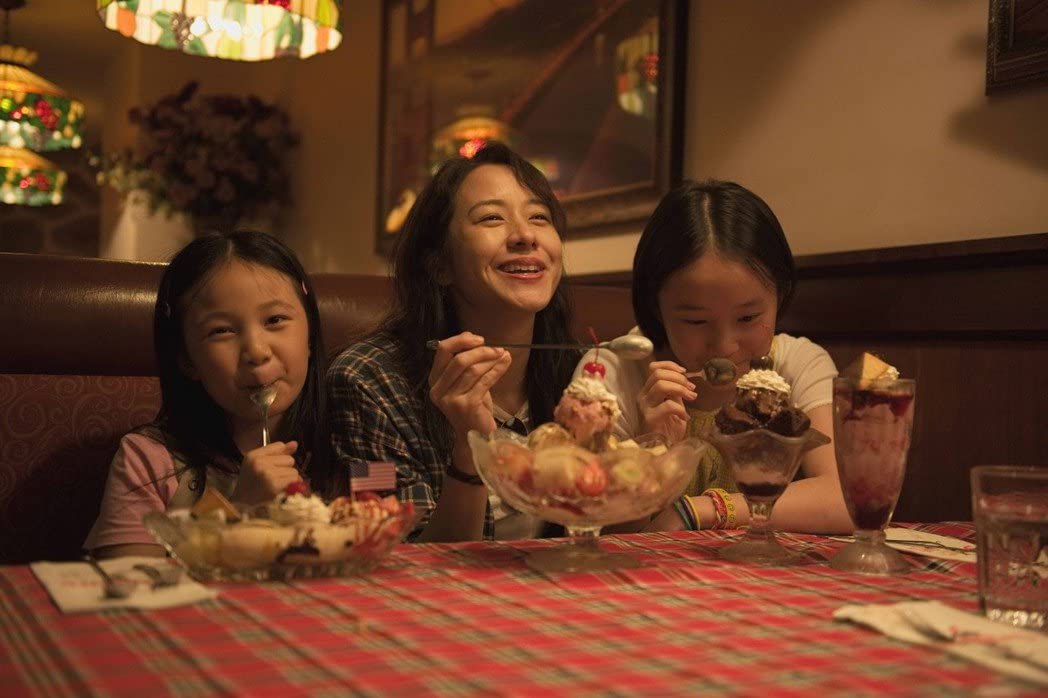 Eating ice cream in a lovely restaurant made Lily and her girls happy, and it felt like they were back in America. This is, in my opinion, the most painful scene in the entire film.